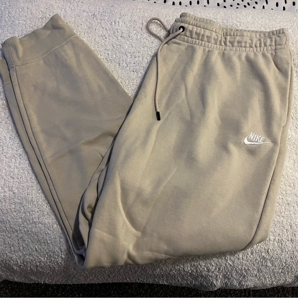 Beige nike jogger sweats.